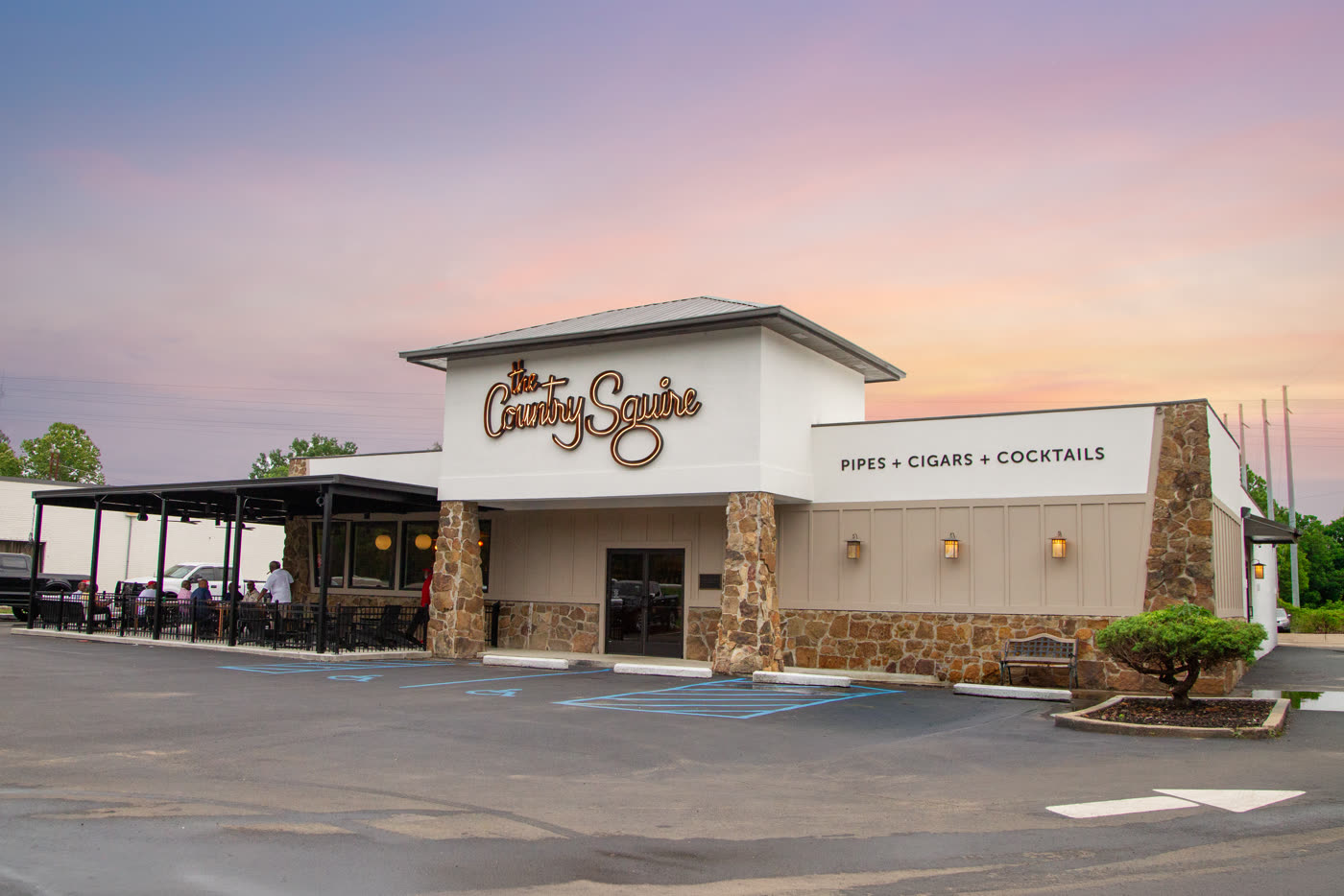 The new Country Squire building at sunset — pipes, cigars, cocktails